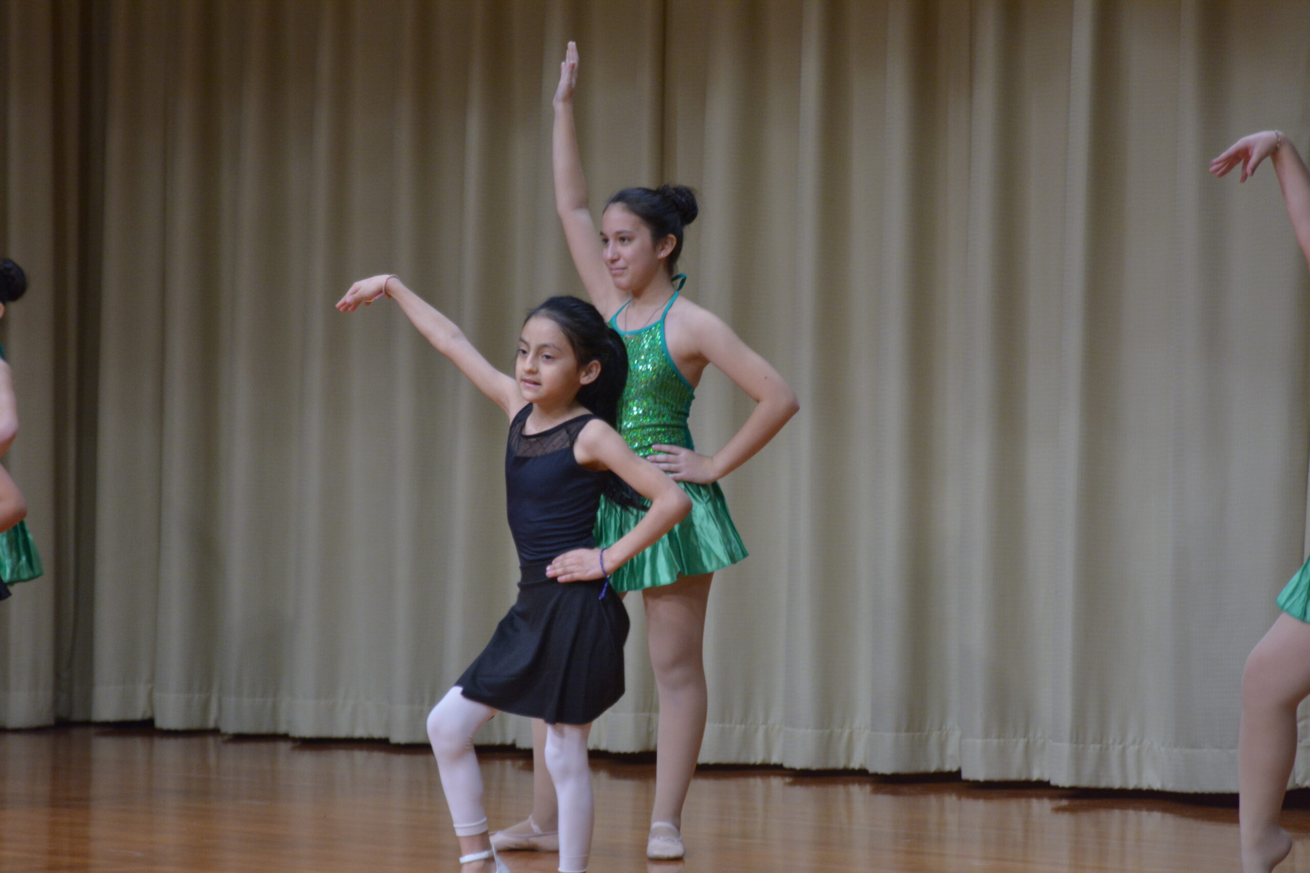 Two dancers dancing on a stage