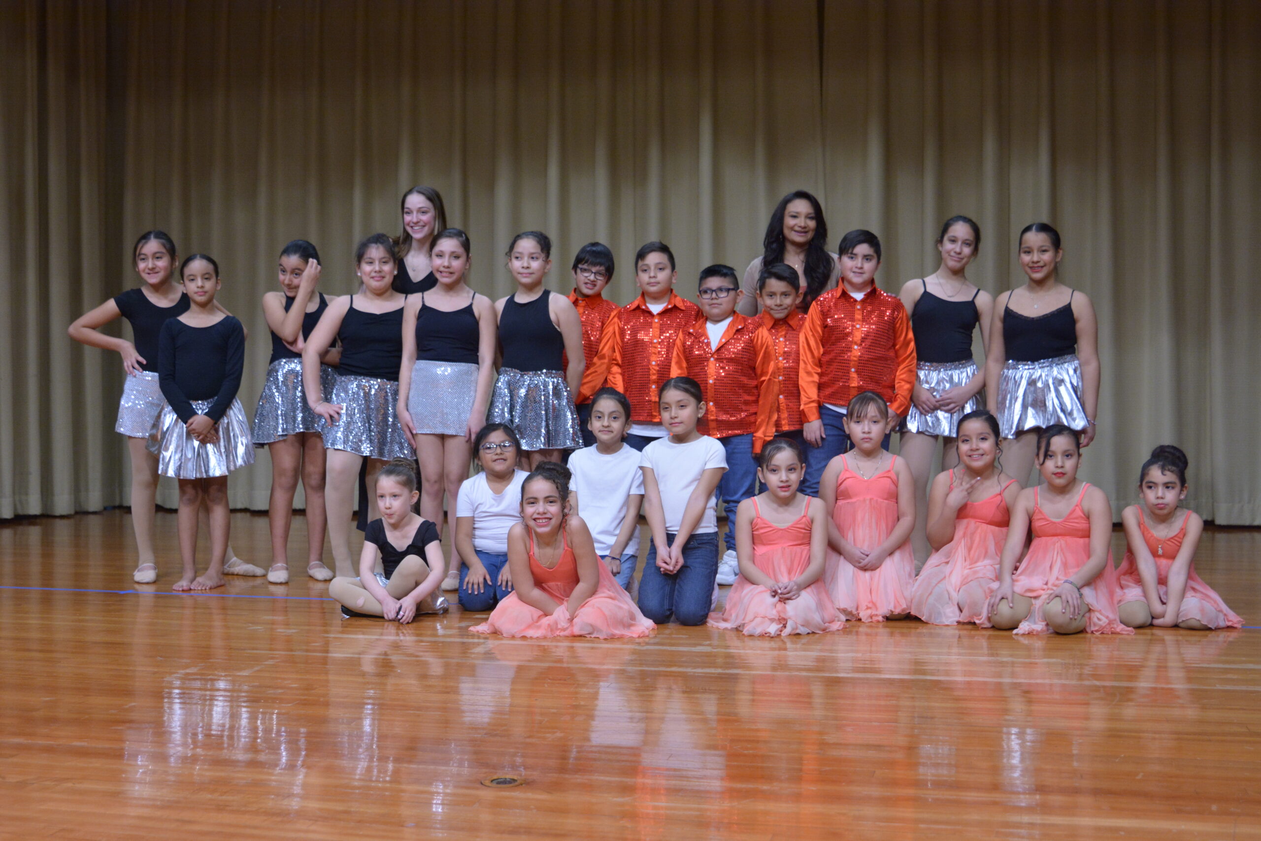 Group of kids posing on stage